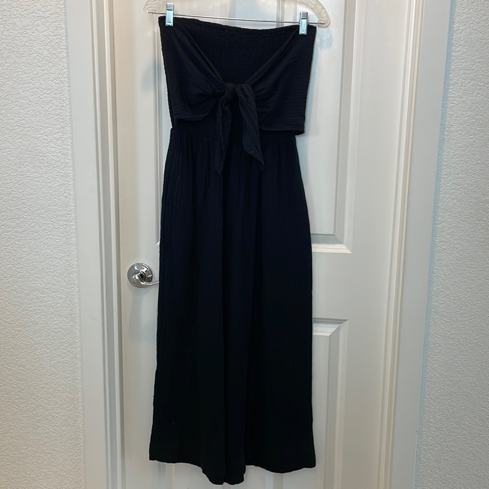 Smocked, wrap top jumpsuit. Never worn.